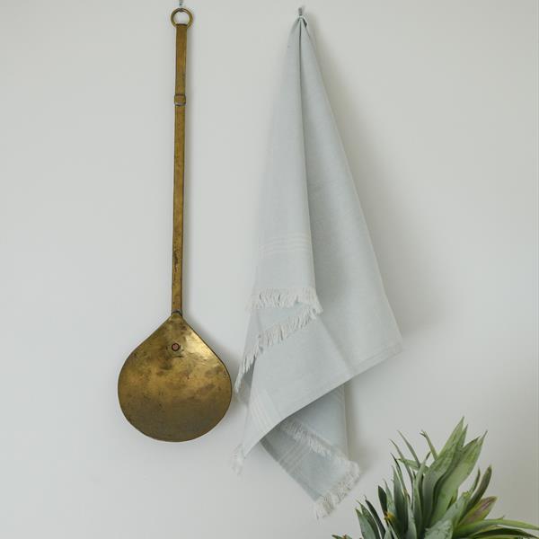 hanging pale blue tea towel with white strip