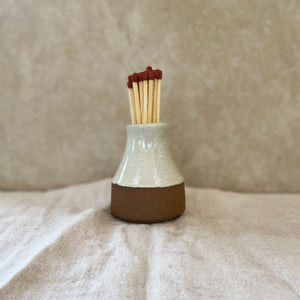 handmade ceramic match bottle with matches and striker