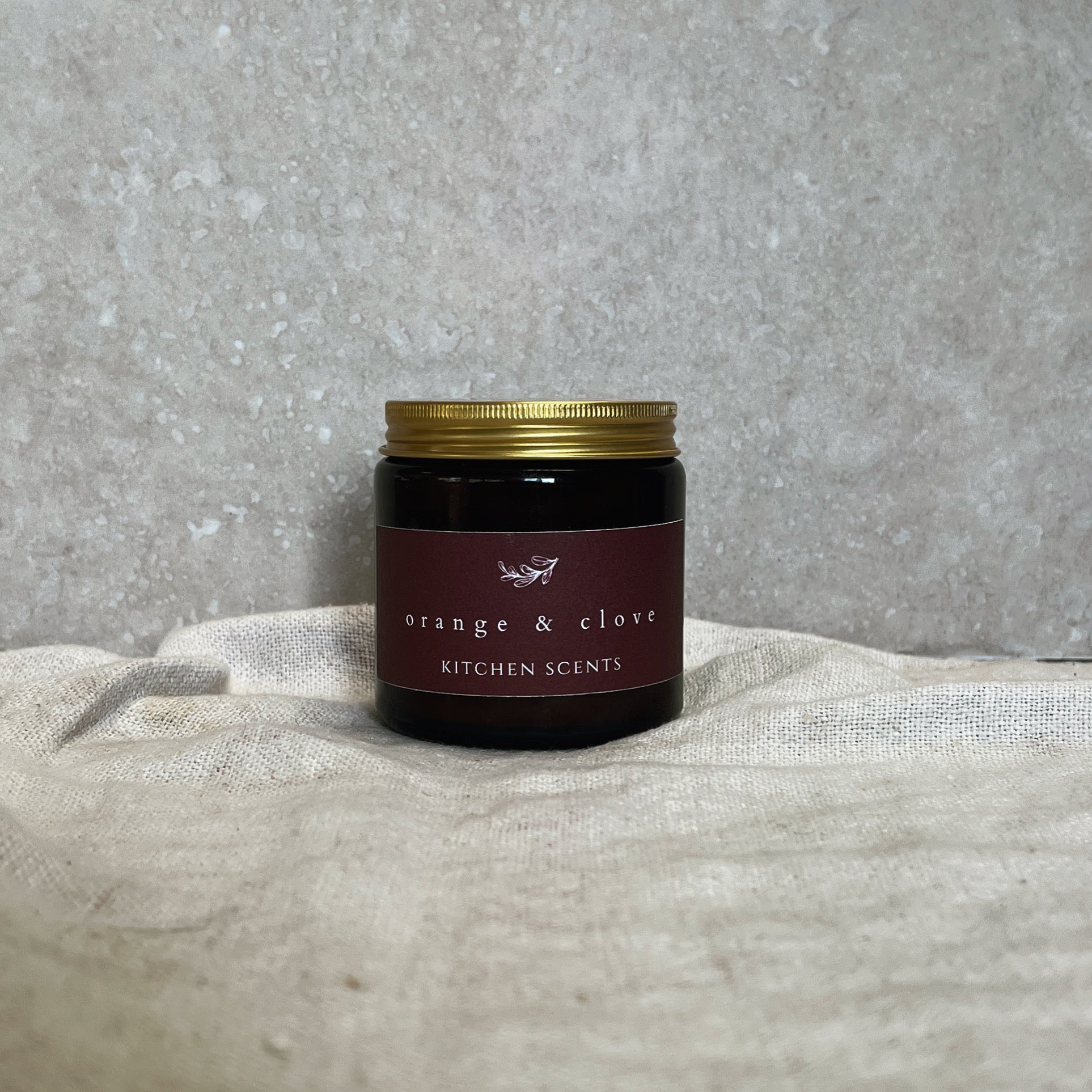 orange and clove scented soy wax candle 