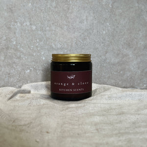 orange and clove scented soy wax candle 