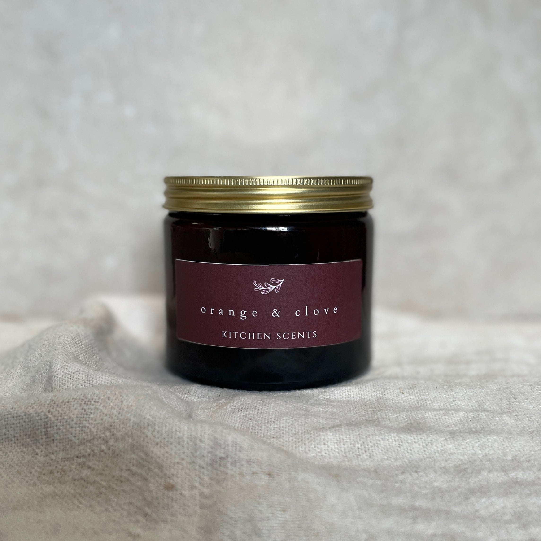 orange and clove scented soy wax candle 