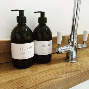 sea salt hand and body wash and lotion in amber bottle with pump